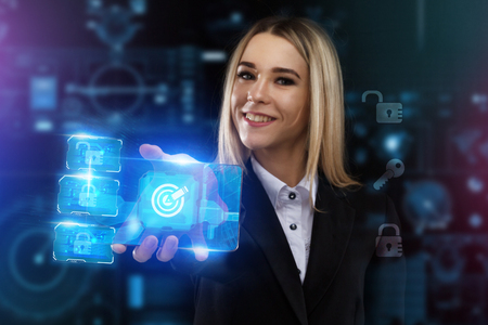 The concept of business, technology, the Internet and the network. A young entrepreneur working on a virtual screen of the future and sees the inscription: targetの写真素材