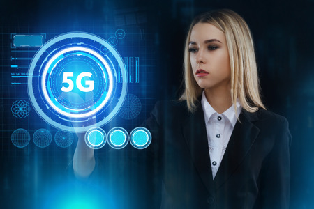 The concept of business, technology, the Internet and the network. A young entrepreneur working on a virtual screen of the future and sees the inscription: 5Gの写真素材