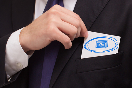 Business, technology, internet and networking concept. Young entrepreneur showing keyword: moneyの写真素材