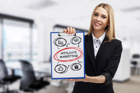 Business, technology, internet and networking concept. Young entrepreneur showing keyword: Affiliate marketingの写真素材