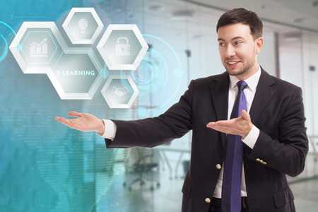 The concept of business, technology, the Internet and the network. A young entrepreneur working on a virtual screen of the future and sees the inscription: E-learningの写真素材