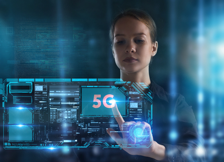 The concept of business, technology, the Internet and the network. A young entrepreneur working on a virtual screen of the future and sees the inscription: 5Gの写真素材