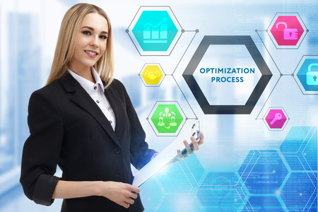 The concept of business, technology, the Internet and the network. A young entrepreneur working on a virtual screen of the future and sees the inscription: Optimization processの写真素材