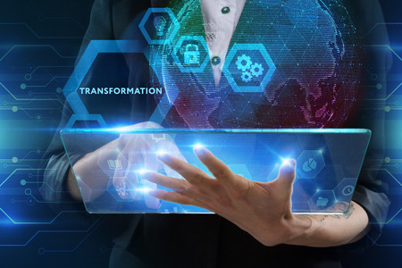 The concept of business, technology, the Internet and the network. A young entrepreneur working on a virtual screen of the future and sees the inscription: Transformationの写真素材
