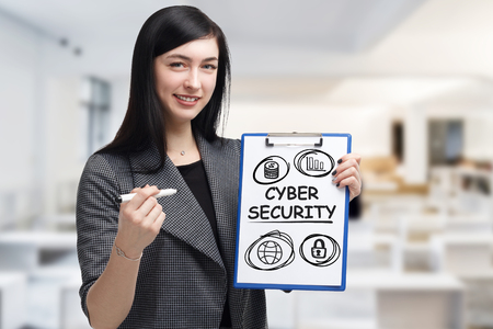 Business, technology, internet and networking concept. Young entrepreneur showing keyword: Cyber securityの写真素材