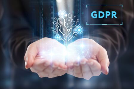 The concept of business, technology, the Internet and the network. A young entrepreneur working on a virtual screen of the future and sees the inscription: GDPRの写真素材