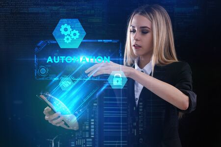 The concept of business, technology, the Internet and the network. A young entrepreneur working on a virtual screen of the future and sees the inscription: Automationの写真素材