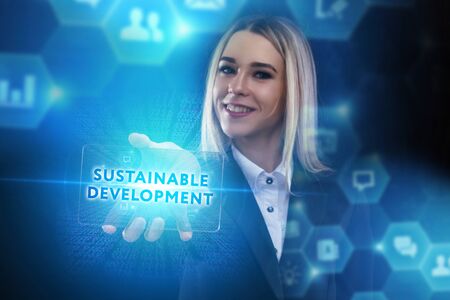 The concept of business, technology, the Internet and the network. A young entrepreneur working on a virtual screen of the future and sees the inscription: Sustainable developmentの写真素材