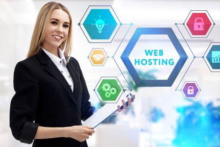 The concept of business, technology, the Internet and the network. A young entrepreneur working on a virtual screen of the future and sees the inscription: Web hostingの写真素材