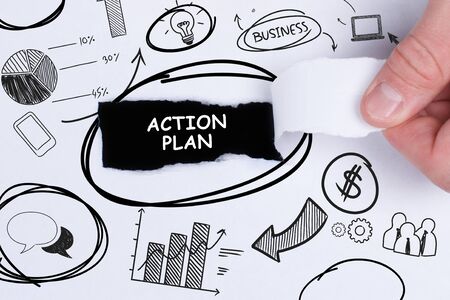 Business, technology, internet and networking concept. Young entrepreneur showing keyword: Action planの写真素材