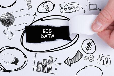 Business, technology, internet and networking concept. Young entrepreneur showing keyword: Big dataの写真素材