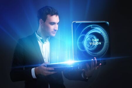 The concept of business, technology, the Internet and the network. A young entrepreneur working on a virtual screen of the future and sees the inscription: Our visionの写真素材
