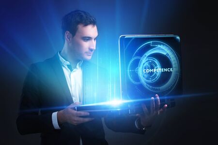 The concept of business, technology, the Internet and the network. A young entrepreneur working on a virtual screen of the future and sees the inscription: Competenceの写真素材
