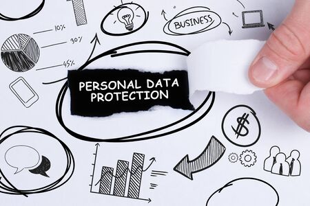 Business, technology, internet and networking concept. Young entrepreneur showing keyword: Personal data protectionの写真素材