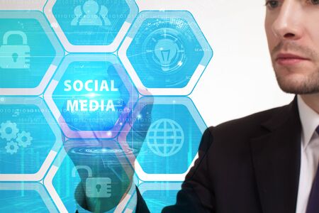 The concept of business, technology, the Internet and the network. A young entrepreneur working on a virtual screen of the future and sees the inscription: Social mediaの写真素材