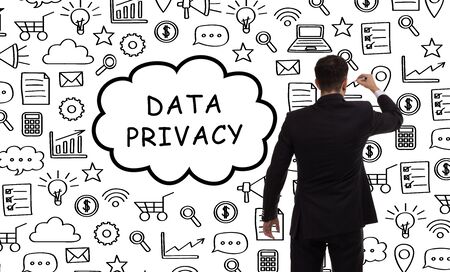 Business, technology, internet and networking concept. Young entrepreneur showing keyword: Data privacyの写真素材