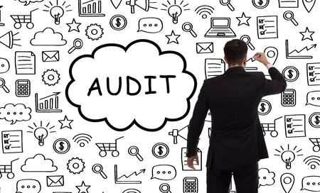 Business, technology, internet and networking concept. Young entrepreneur showing keyword: Auditの写真素材