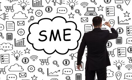 Business, technology, internet and networking concept. Young entrepreneur showing keyword: SMEの写真素材