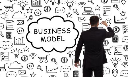 Business, technology, internet and networking concept. Young entrepreneur showing keyword: Business modelの写真素材