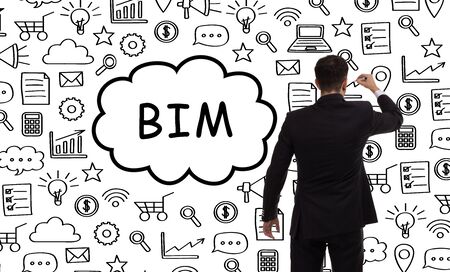 Business, technology, internet and networking concept. Young entrepreneur showing keyword: BIMの写真素材