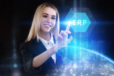 The concept of business, technology, the Internet and the network. A young entrepreneur working on a virtual screen of the future and sees the inscription: ERPの写真素材