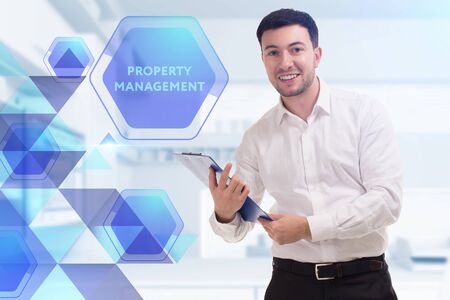 The concept of business, technology, the Internet and the network. A young entrepreneur working on a virtual screen of the future and sees the inscription: Property managementの写真素材