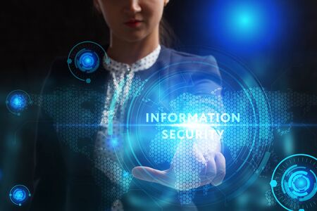 Business, Technology, Internet and network concept. Young businessman working on a virtual screen of the future and sees the inscription: Information securityの写真素材