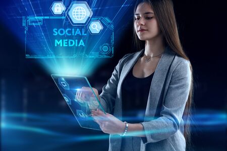 Business, Technology, Internet and network concept. Young businessman working on a virtual screen of the futureの写真素材