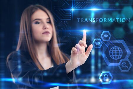 Business, Technology, Internet and network concept. Young businessman working on a virtual screen of the future and sees the inscription: Transformationの写真素材