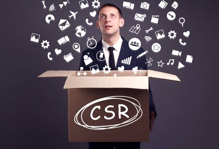 Business, technology, internet and network concept. A young businessman collects information to become successful: CSRの写真素材