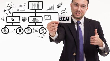 Business, technology, internet and network concept. Young businessman thinks over the steps for...