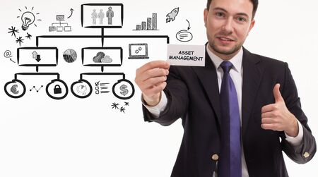 Business, technology, internet and network concept. Young businessman thinks over the steps for successful growth: Asset managementの写真素材