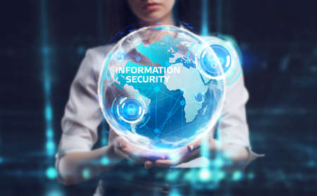 Business, Technology, Internet and network concept. Young businessman working on a virtual screen of the future and sees the inscription: Information securityの写真素材