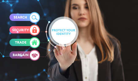Business, Technology, Internet and network concept. Young businessman working on a virtual screen of the future and sees the inscription: Protect your identityの写真素材