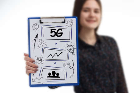 Business, technology, internet and network concept. Young businessman thinks over the steps for successful growth: 5Gの写真素材