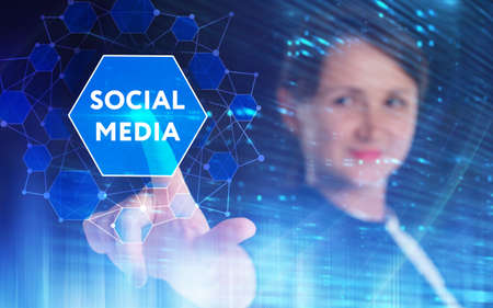 Business, Technology, Internet and network concept. Young businessman working on a virtual screen of the future and sees the inscription:の写真素材