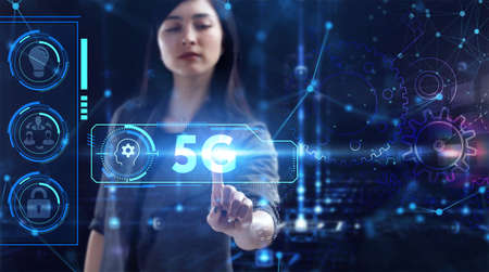 Business, Technology, Internet and network concept. Young businesswoman working on a virtual screen of the futureの写真素材