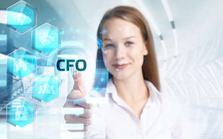 Business, Technology, Internet and network concept. Young businessman working on a virtual screen of the future and sees the inscription: CFOの写真素材
