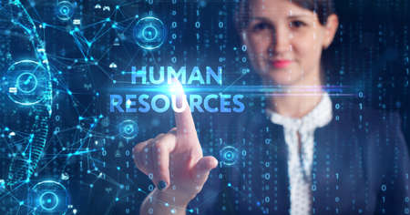 Business, Technology, Internet and network concept. Young businessman working on a virtual screen of the future and sees the inscription: Human resourcesの写真素材