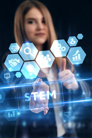 Business, Technology, Internet and network concept. Young businessman working on a virtual screen of the future and sees the inscription: STEMの写真素材