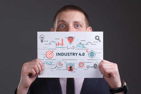 Business, technology, internet and network concept. Young businessman thinks over the steps for successful growth: Industry 4.0の写真素材
