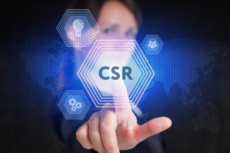 Business, Technology, Internet and network concept. Young businessman working on a virtual screen of the future and sees the inscription: CSRの写真素材