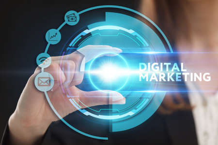 Business, Technology, Internet and network concept. Young businessman working on a virtual screen of the future and sees the inscription: Digital marketingの写真素材