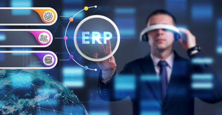 Business, Technology, Internet and network concept. Young businessman working on a virtual screen of the future and sees the inscription: ERPの写真素材
