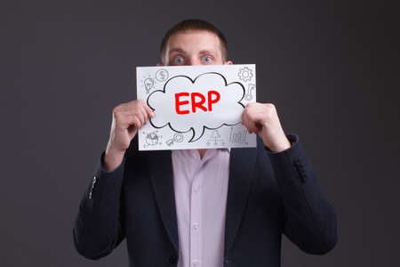 Business, technology, internet and network concept. Young businessman thinks over the steps for successful growth: ERPの写真素材
