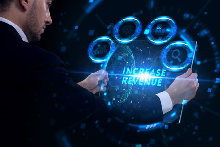 Business, Technology, Internet and network concept. Young businessman working on a virtual screen of the future and sees the inscription: Increase revenueの写真素材