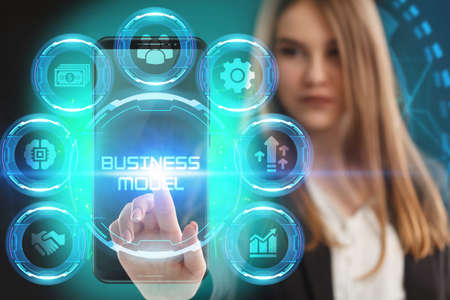 Business, Technology, Internet and network concept. Young businessman working on a virtual screen of the future and sees the inscription: Business modelの写真素材