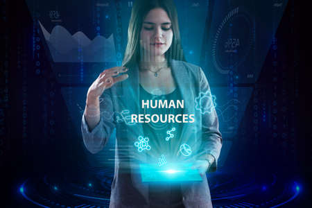 Business, Technology, Internet and network concept. Young businessman working on a virtual screen of the future and sees the inscription: Human resourcesの写真素材