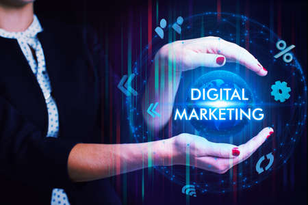 Business, Technology, Internet and network concept. Young businessman working on a virtual screen of the future and sees the inscription: Digital marketingの写真素材