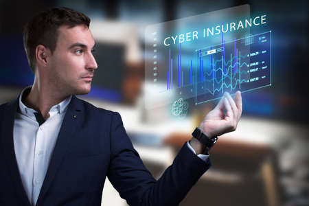 Business, Technology, Internet and network concept. Young businessman working on a virtual screen of the future and sees the inscription: Cyber insuranceの写真素材